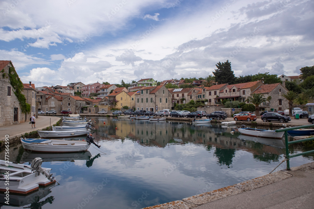 Vrboska/ Croatia-August 7th, 2020: Colorful houses of Vrboska town, small place on the Hvar island located in deep, natural bay, used as port
