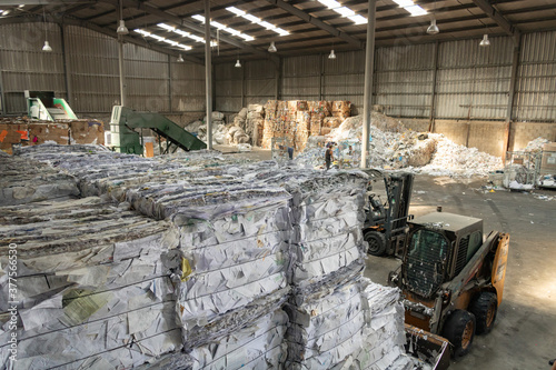 Fotografie Upper View of Industrial Warehouse with paper, cardboard bales for recycling pro