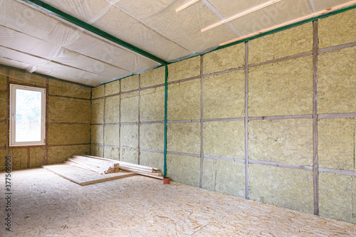 Wall insulation with mineral slabs in a frame house photo