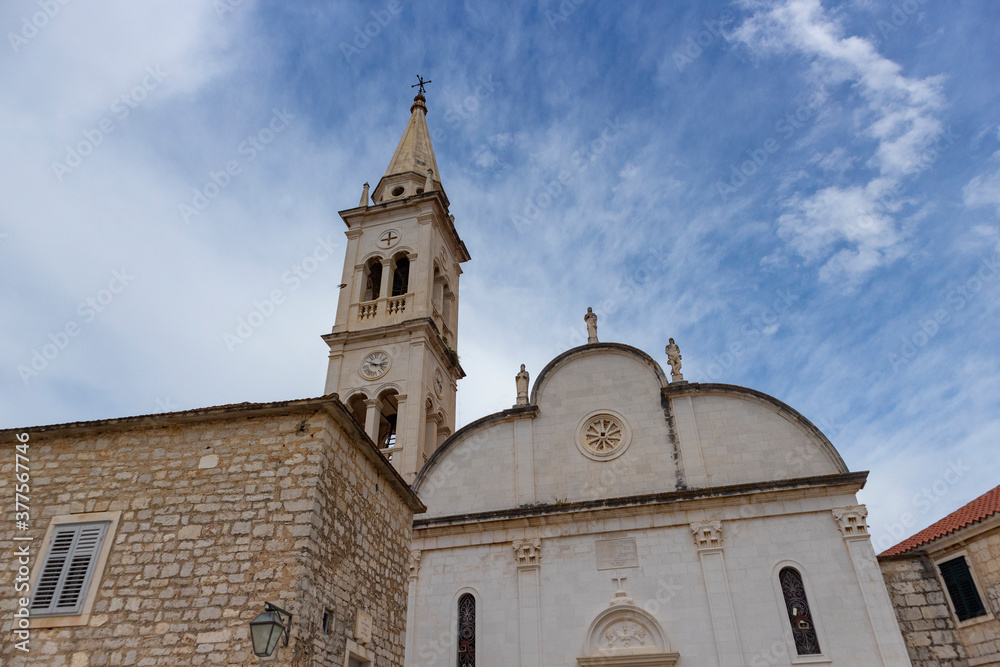 Jelsa/ Croatia-August 7th, 2020: Fascinating fortified church of St. Mary in town of Jelsa on the island of Hvar, beautiful piece of Dalmatian architecture