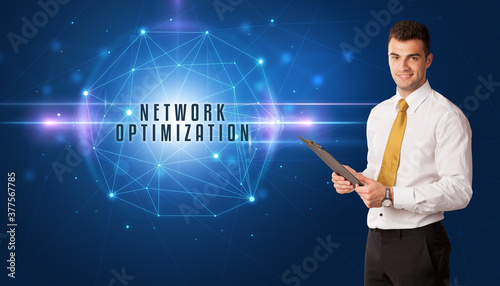 Businessman thinking about security solutions with NETWORK OPTIMIZATION inscription