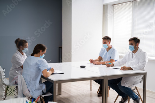 Medical Doctor Students At Desk Learning