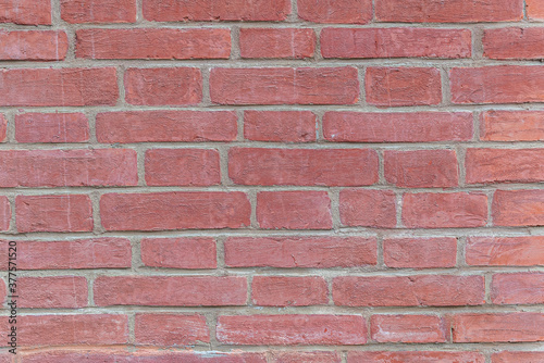 abstract background of an old restored brick wall close up