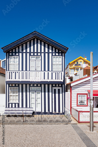 Aveiro, Portugal,  typical fishermen houses with striped colors in costa nova photo