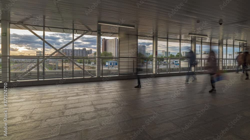 Movement of people on the modern covered pedestrian bridge ,time lapse