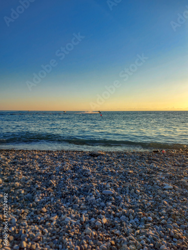 Amazing sunset over a tropical beach in Sochi.