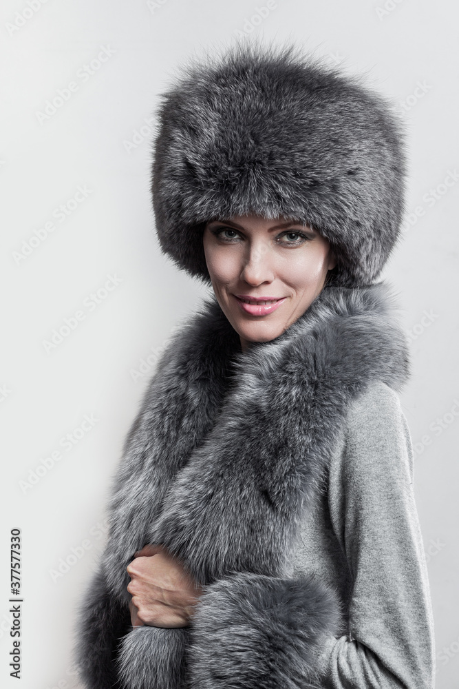 Winter fashion style. Beautiful woman in fur and jewelry. Portrait of young sexy model with beauty makeup Winter fashion style. Beautiful woman in fur and jewelry. Portrait of young sexy model with beauty makeup