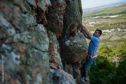 Rock climber on a face of a cliff face