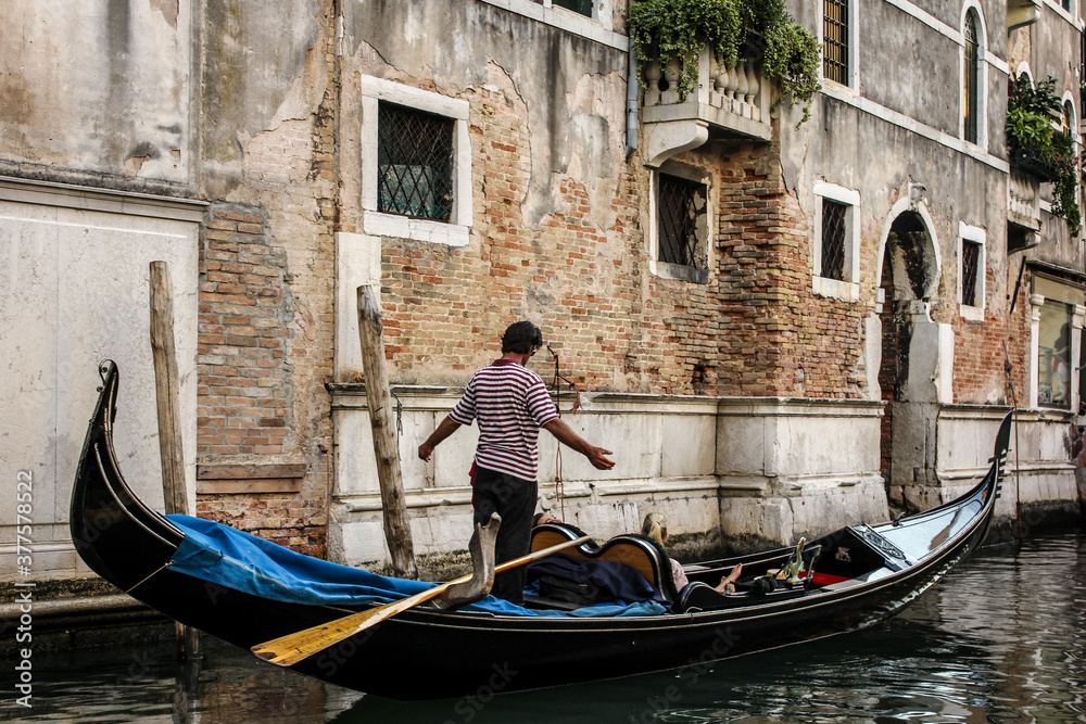 Gondola in Venice with guy singing to passengers