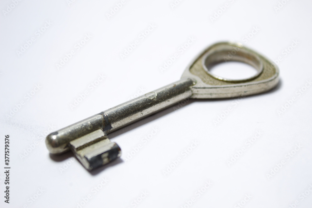 Silver key with old look and white background Silver key with old look and white background