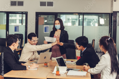 Business people giving each other high five and clapping. Teamwork Power Successful Meeting Workplace Concept