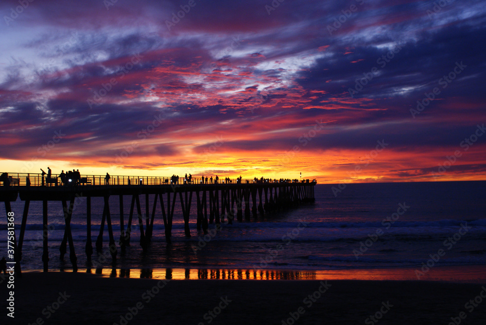 Color sunset with pier silhouette