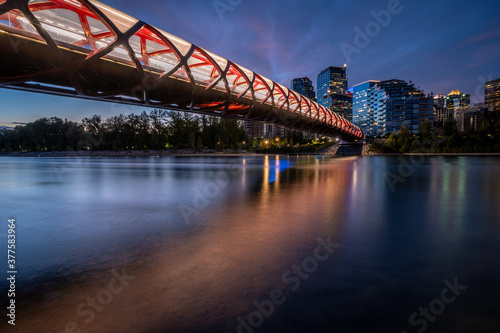 View of pedestrian bridge over the Bow River in Calgary Alberta at sunrise.  © Jeff Whyte