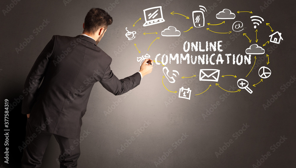 businessman drawing social media icons with ONLINE COMMUNICATION inscription, new media concept businessman drawing social media icons with ONLINE COMMUNICATION inscription, new media concept