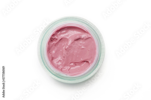 Pink make up or cosmetic in a container isolated on white background, top view