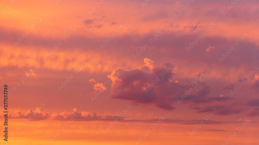 Dramatic Natural Sunset Clouds in Warwickshire UK, with warm vivid orange, yellow and purple tones, depicting a dramatic yet heavenly atmosphere Dramatic Natural Sunset Clouds in Warwickshire UK, with warm vivid orange, yellow and purple tones, depicting a dramatic yet heavenly atmosphere