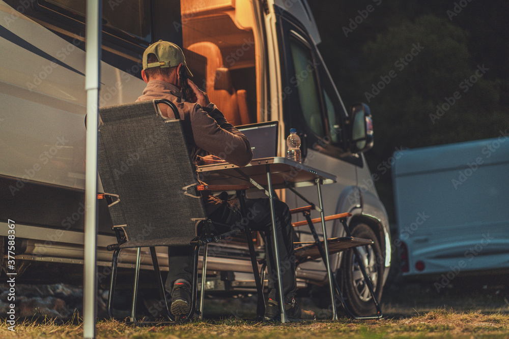 Men Making Business Phone Call While Camper Camping Men Making Business Phone Call While Camper Camping