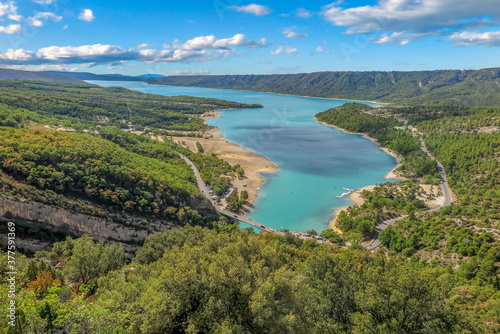 Lake of Sainte-Croix with blue melting water with forest mountains around  commune of Les Salles-sur-Verdon  region of Provence-Alpes-C  te d Azur  Alpes de Haute Provence  France