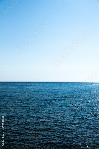 Photo with a flat sea horizon, day