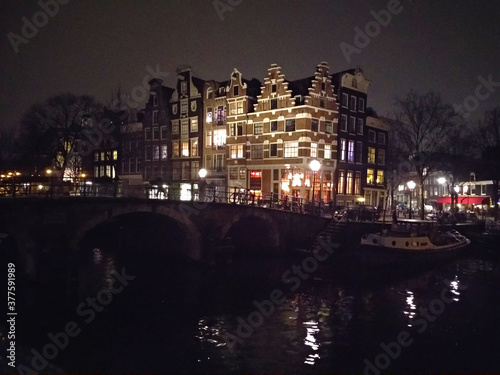 romantic Dutch canals of Amsterdam on a gray day of winter haze