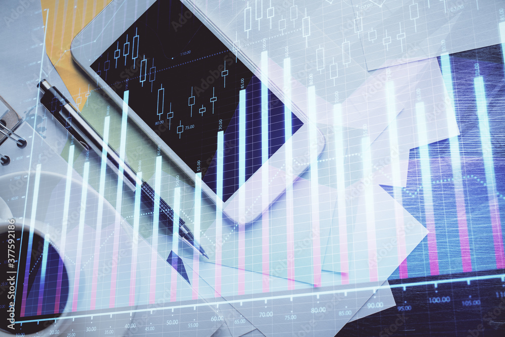 Multi exposure of forex graph hologram over desktop with phone. Top view. Mobile trade platform concept. Multi exposure of forex graph hologram over desktop with phone. Top view. Mobile trade platform concept.