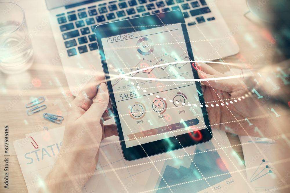 Double exposure of man's hands holding and using a digital device and forex graph drawing. Financial market concept. Double exposure of man's hands holding and using a digital device and forex graph drawing. Financial market concept.