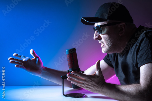 A man speaks into a microph...