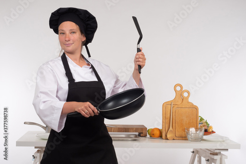 Chef with a frying pan and ...