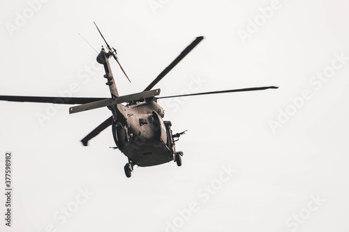 Fototapeta Naklejka Na Ścianę i Meble -  helicopter flying over the sky