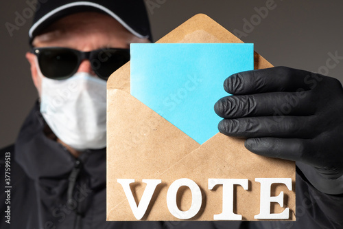 A man votes in an election ...