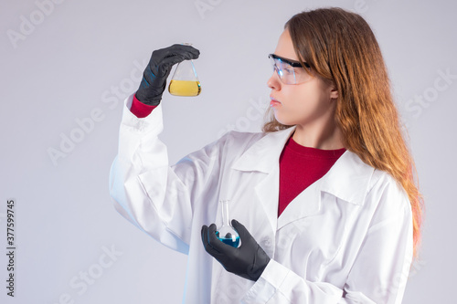 Chemist with the flask in h...