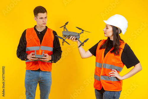 People with a drone. The la...