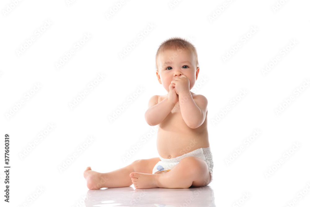 Cute little baby in diaper clapping hand on floor Cute little baby in diaper clapping hand on floor