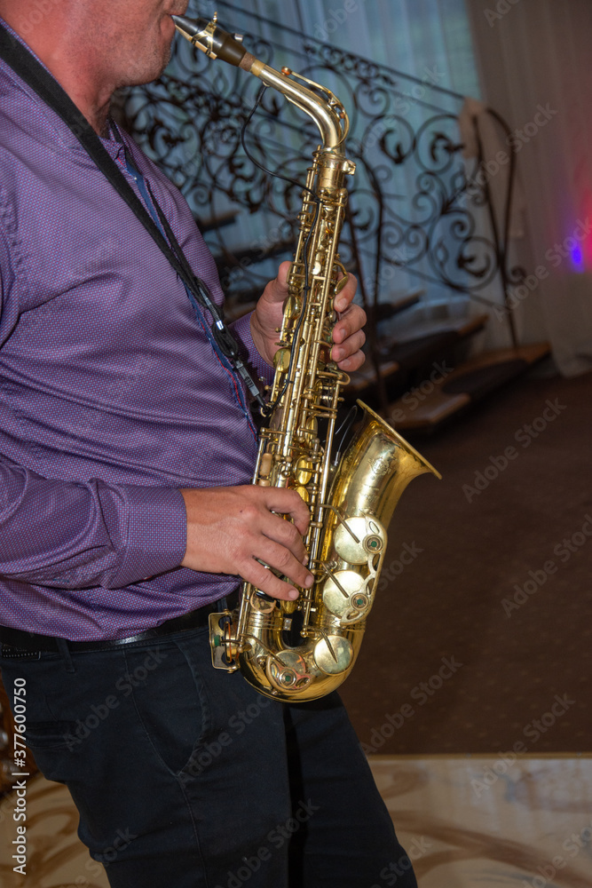 Fototapeta premium Man plays the saxophone