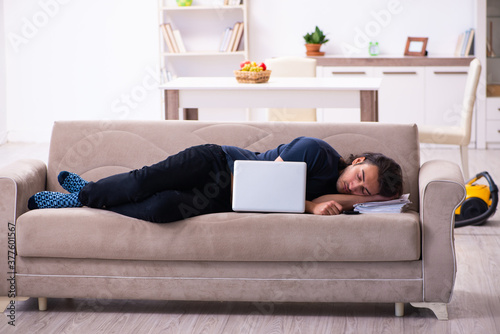 Young man employee working from house photo