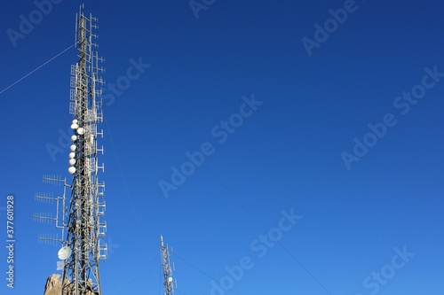 communication, telecommunication and television antennas, positioned between the rocks of the mountains at the top.