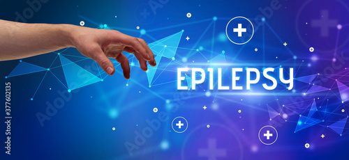 Close-Up of cropped hand pointing at EPILEPSY inscription  medical concept