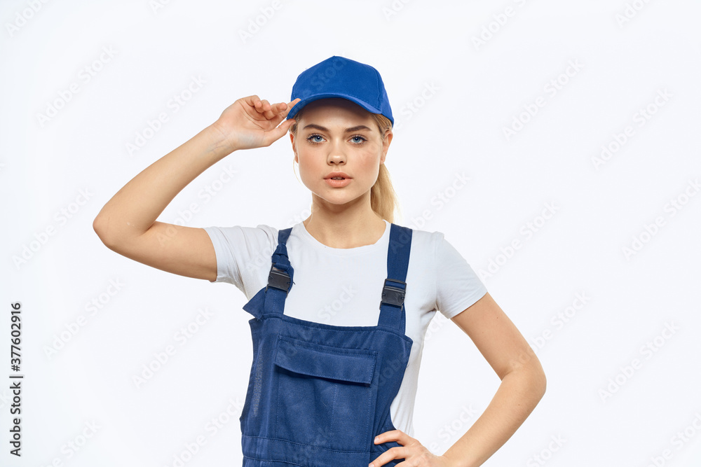 Woman in working uniform blue cap delivery courier delivery service Woman in working uniform blue cap delivery courier delivery service