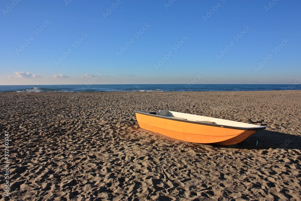 fishing boat of a fisherman. ship stranded on the sandy beach fishing boat of a fisherman. ship stranded on the sandy beach