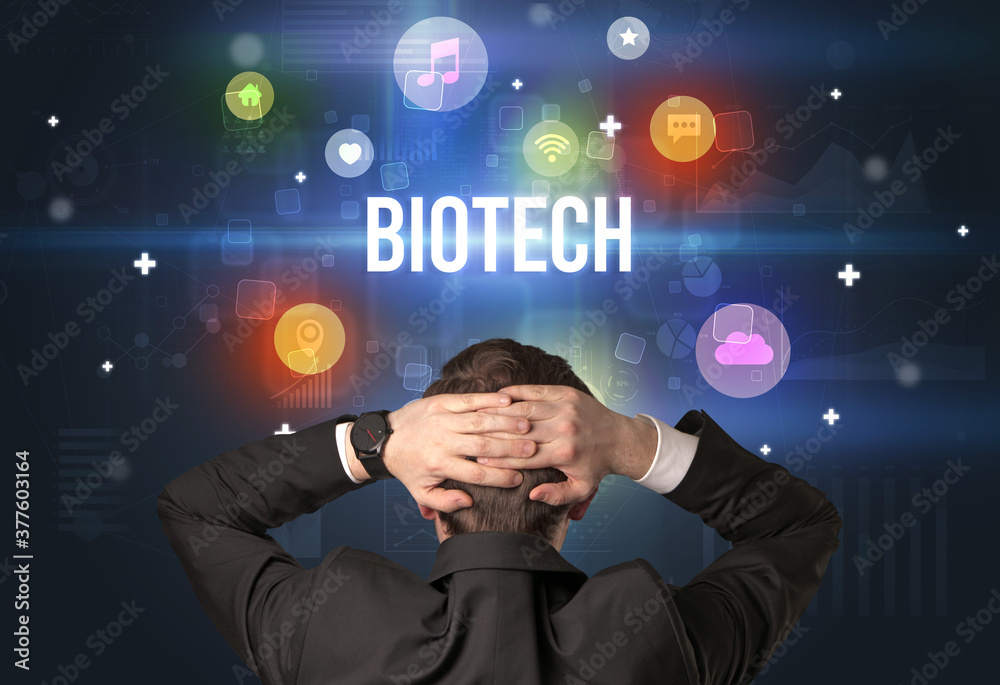 Rear view of a businessman with BIOTECH inscription, modern technology concept