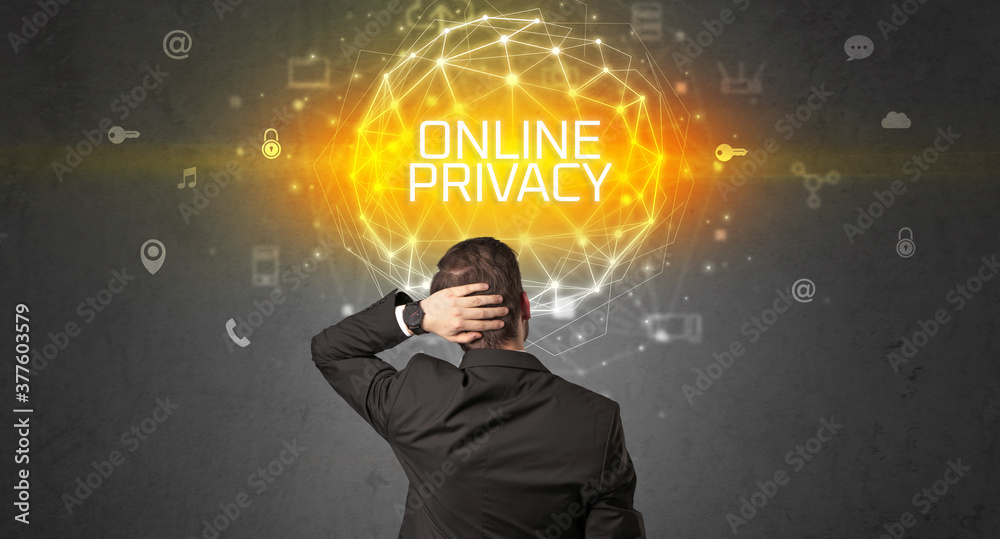 Rear view of a businessman with ONLINE PRIVACY inscription, online security concept Rear view of a businessman with ONLINE PRIVACY inscription, online security concept