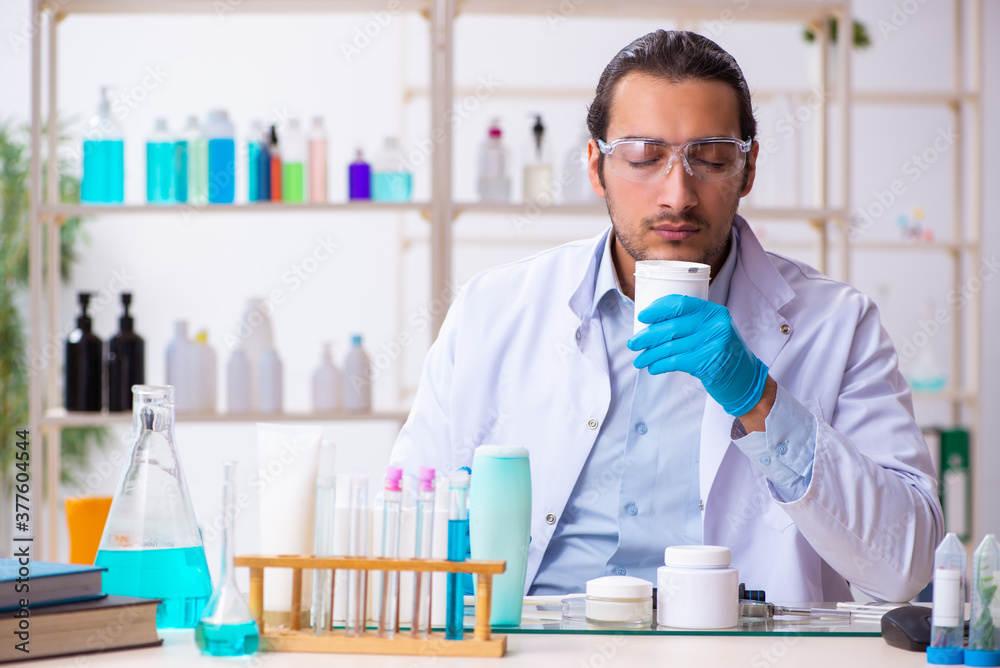 Young male chemist working in the lab Young male chemist working in the lab