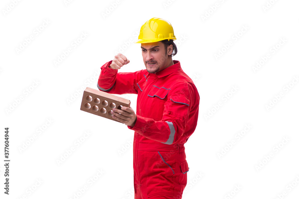 Young male mason with brick isolated on white Young male mason with brick isolated on white