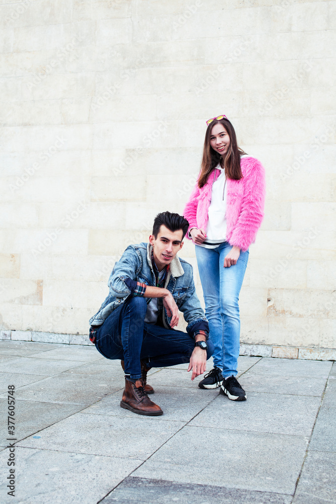 young pretty couple of student boy and girl together outside happy smiling, lifestyle people concept young pretty couple of student boy and girl together outside happy smiling, lifestyle people concept