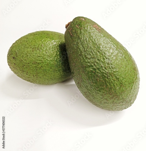 Two green avocados isolated...