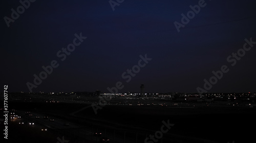 Night in the City. Faint lights from buildings and cars softly illuminate the almost pitch black skyline in St Louis, Missouri.