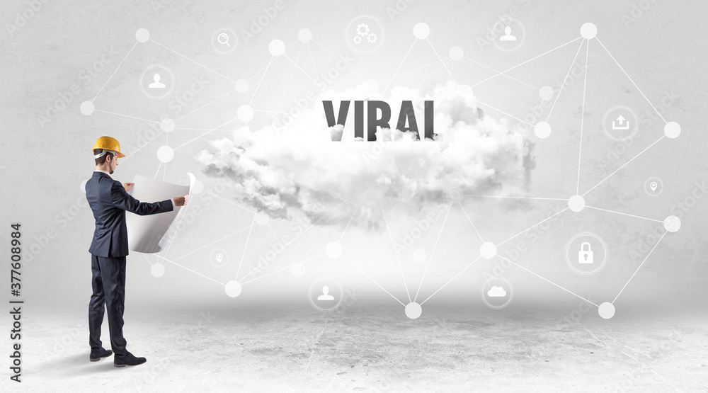 Engineer working on a social media concept with VIRAL inscription Engineer working on a social media concept with VIRAL inscription