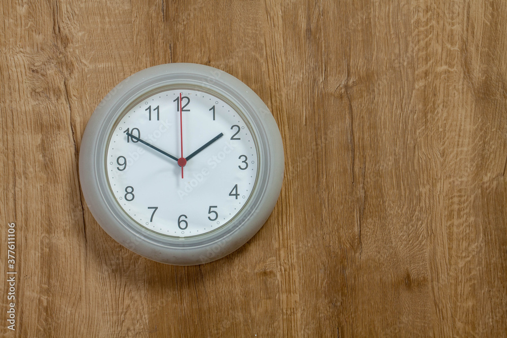 clock on a wooden wall clock on a wooden wall