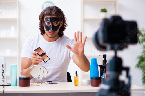 Young male cosmetician recording video for his blog © Elnur