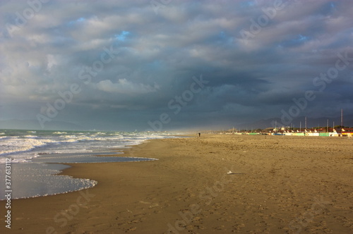 by the sea on the sandy beach of an Italian beach establishment in Versilia, Tuscany